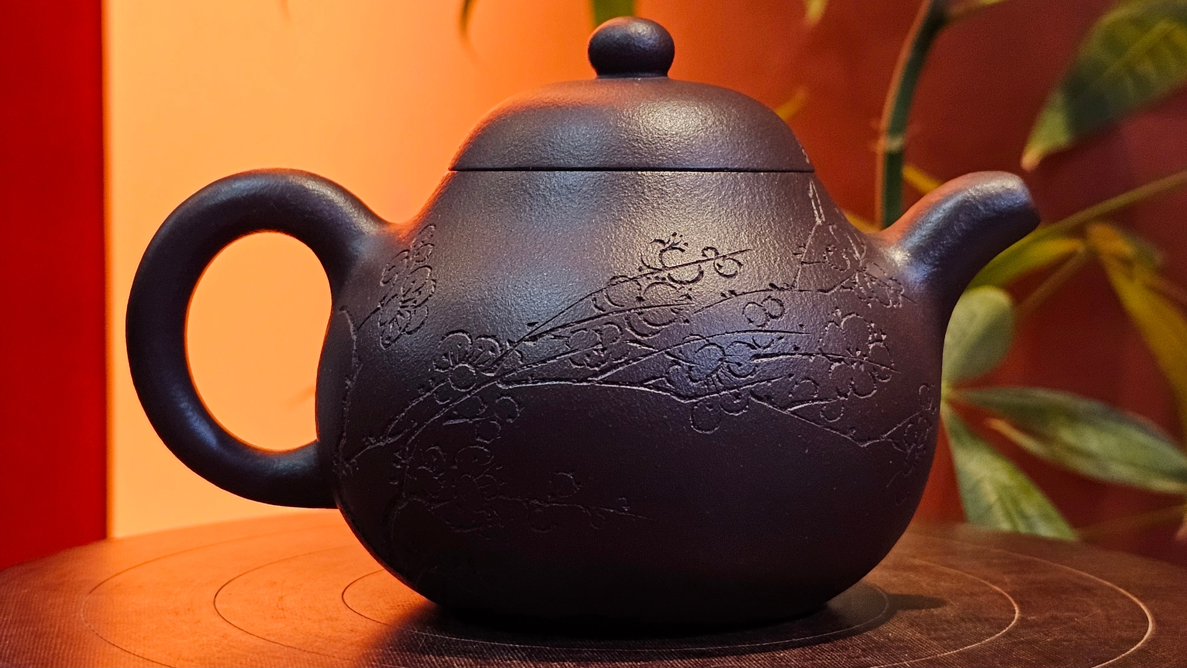 Pan Hu 番壶, 196.3ml, Da Shui Tan Zi Ni 大水潭紫泥, by our Craftsman Zhang Huan 张欢, with Plum Blossoms and Calligraphy Engraving by Craftsman Peng Peng 芃芃。